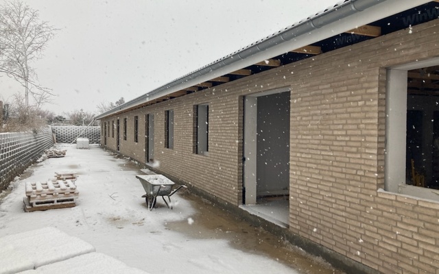 Ejendomsudviklere søger lån til opførelse af rækkehuse som del af et boligprojekt i Nordsjælland